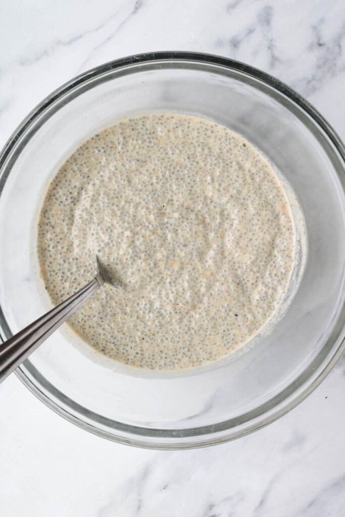 peanut butter chia pudding in a glass bowl after setting.