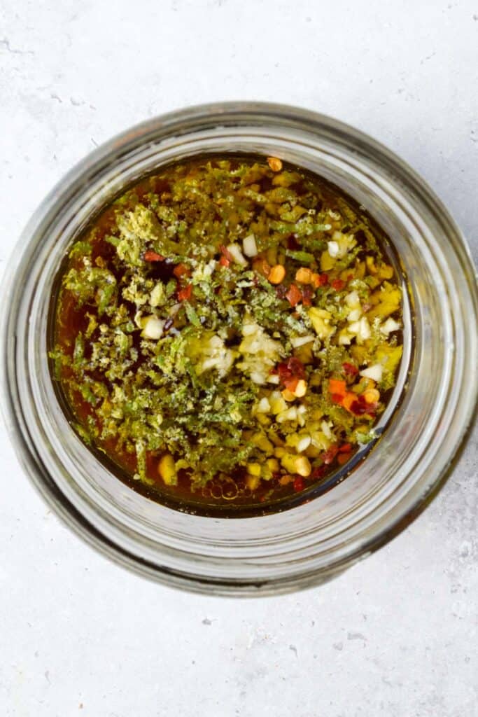 dressing ingredients in a glass jar.