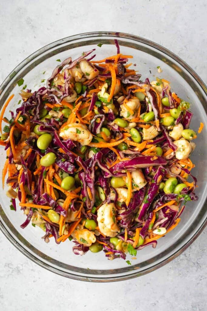 finished shrimp edamame salad in a glass bowl.
