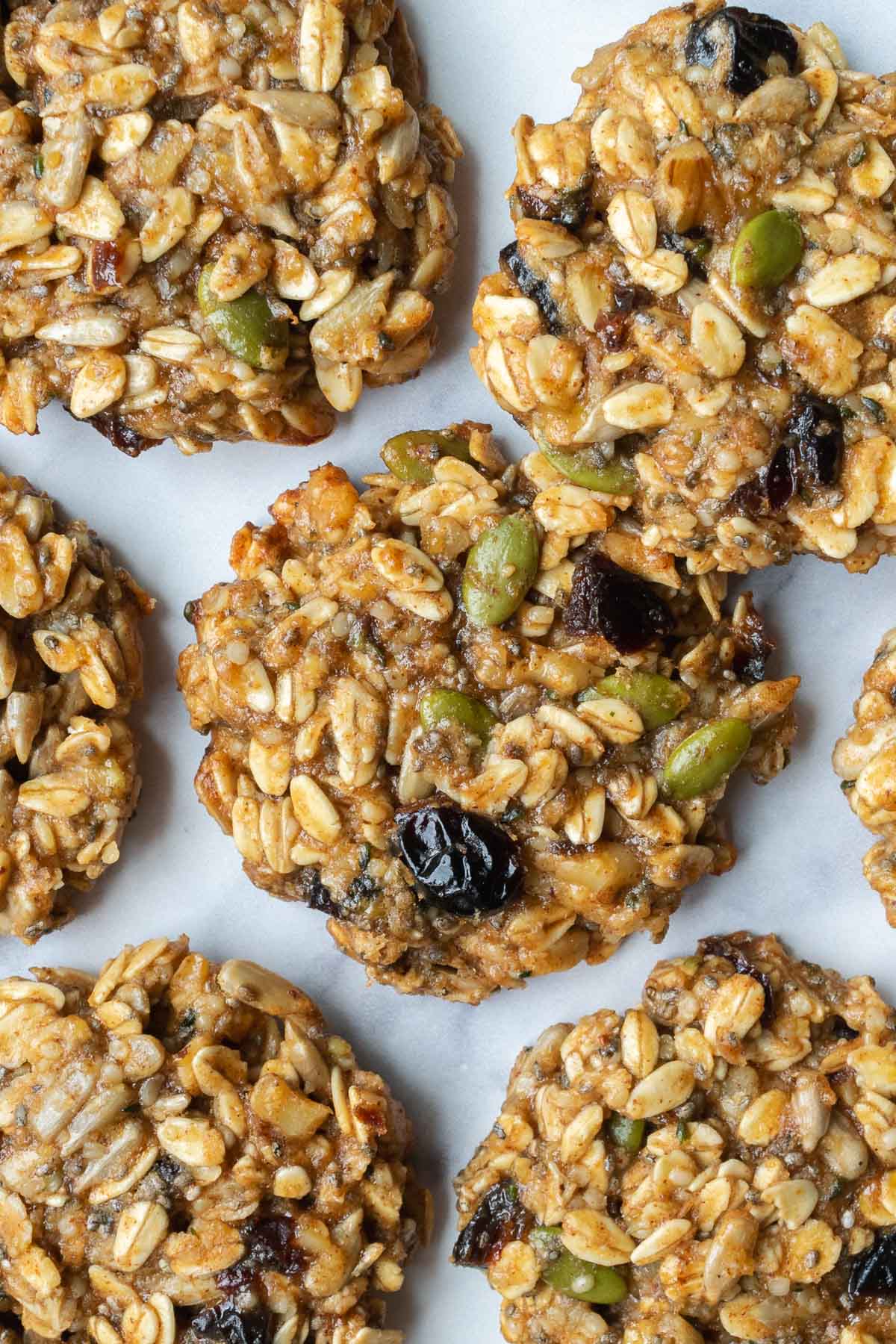 overhead view of trail mix cookies on a baking sheet