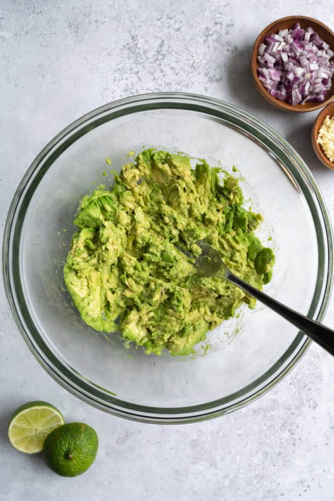 a bowl of mashed avocado.