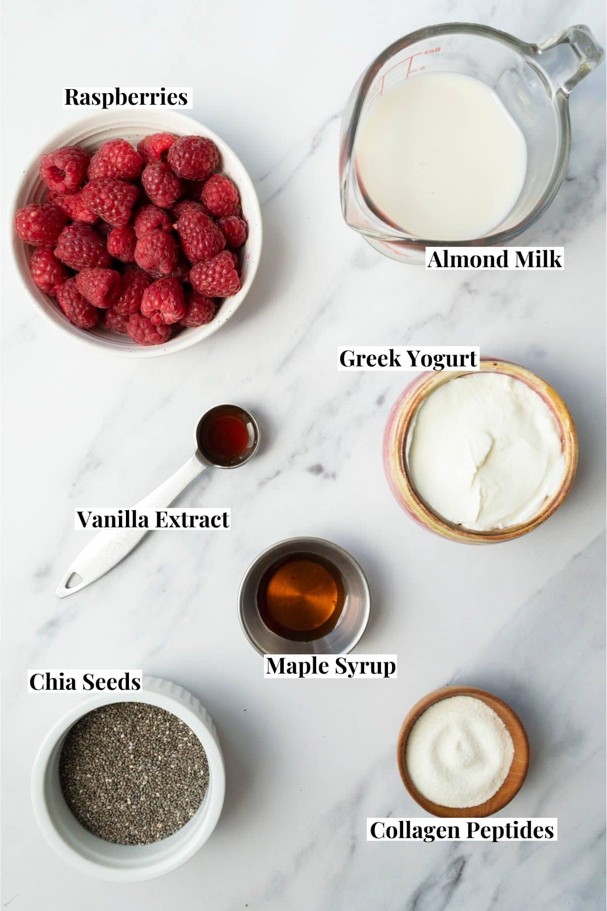 raspberry chia pudding ingredients in bowls and measuring cups. 