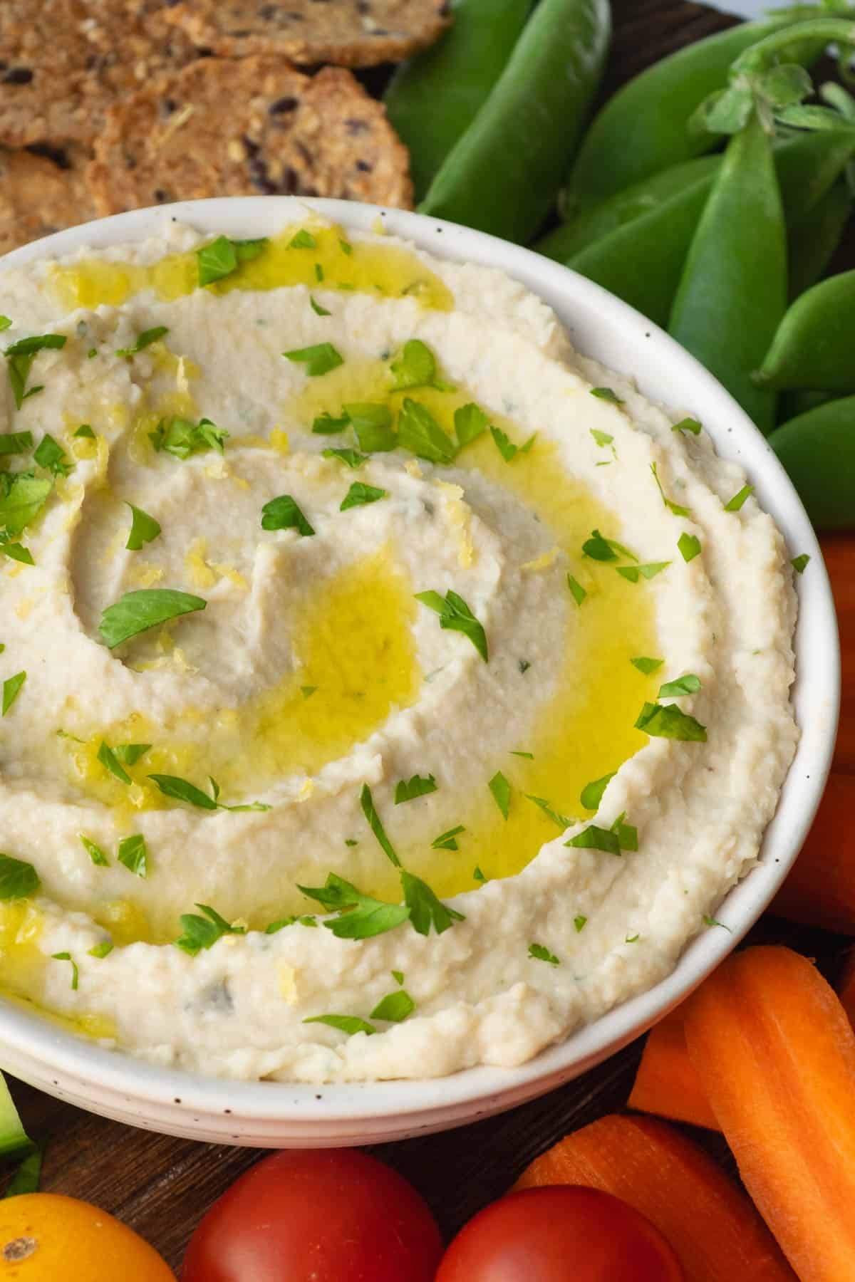 artichoke white bean dip in a bowl.